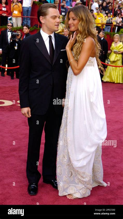 Oscar nominee Leonardo DiCaprio, in Prada, and his girlfriend